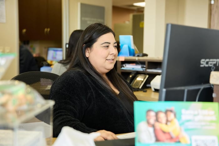 A woman sitting in front of a computer