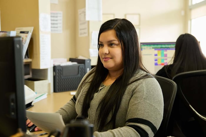 A woman sitting in front of a computer