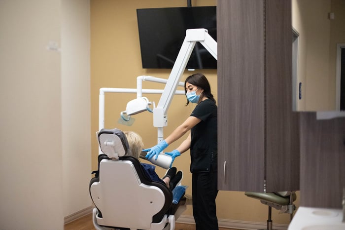 A dentist talking to a patient