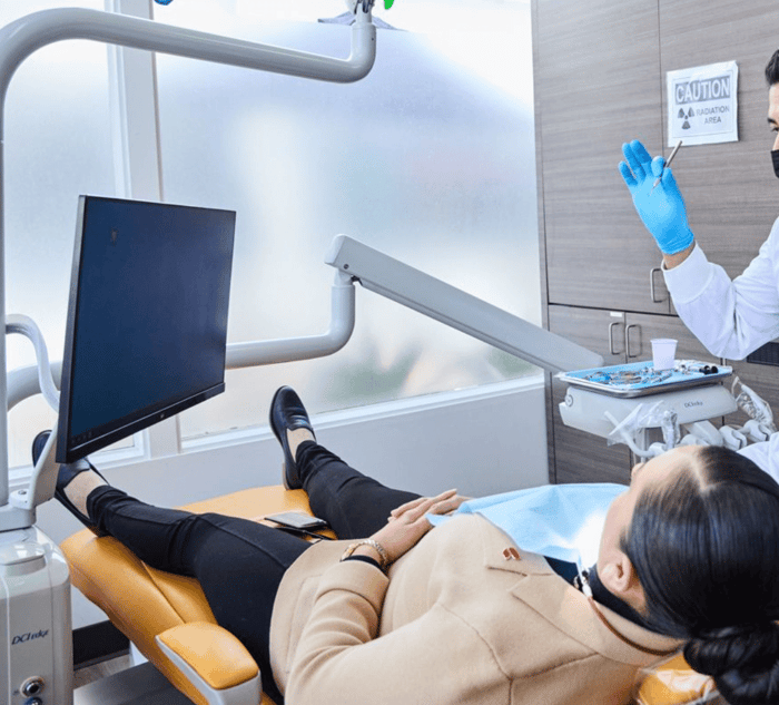 A patient lying on a dental chair