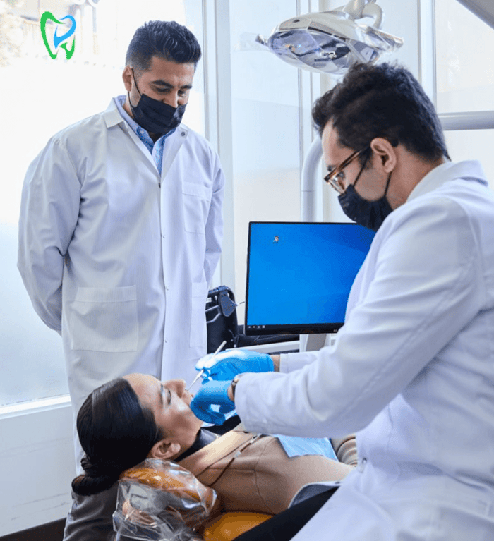 Two dentist working on a patient