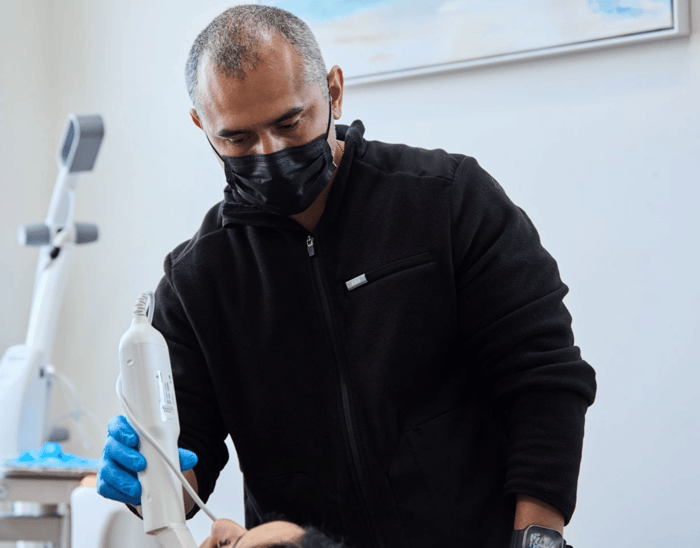 A person wearing black mask