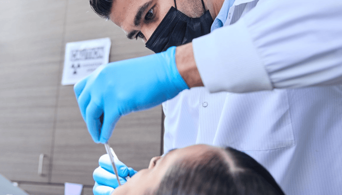 A dentist working on a patient