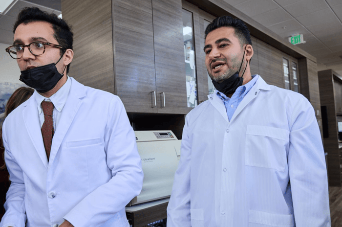 Two dentist standing next to each other