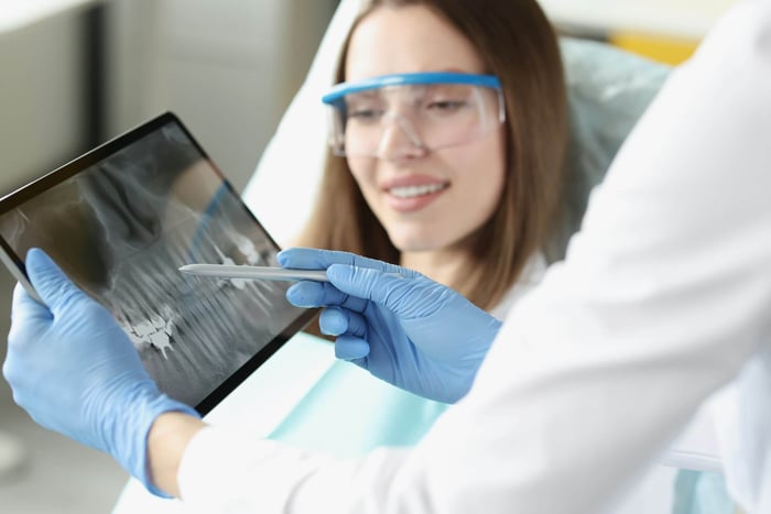 A woman checking a tablet