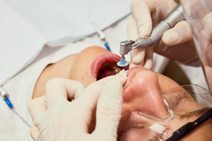 A person being checked on the teeth