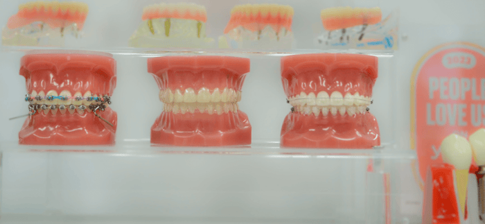 Three dentures on a glass