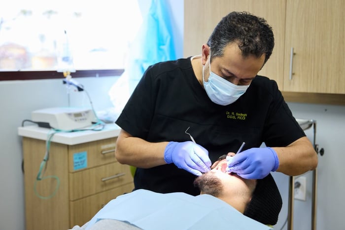 A dentist working on a patient