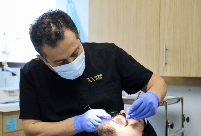A dentist working on a patient