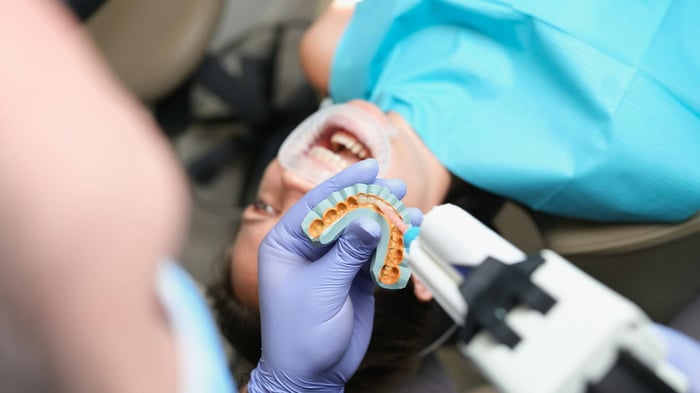 A patient lying on a dental chair