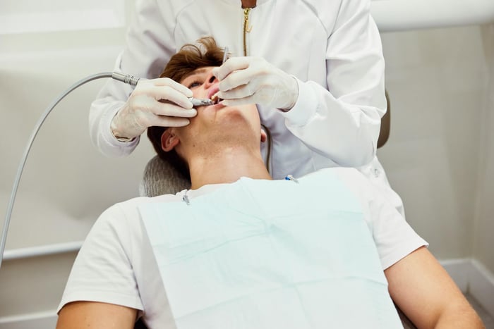 A dentist working on a patient