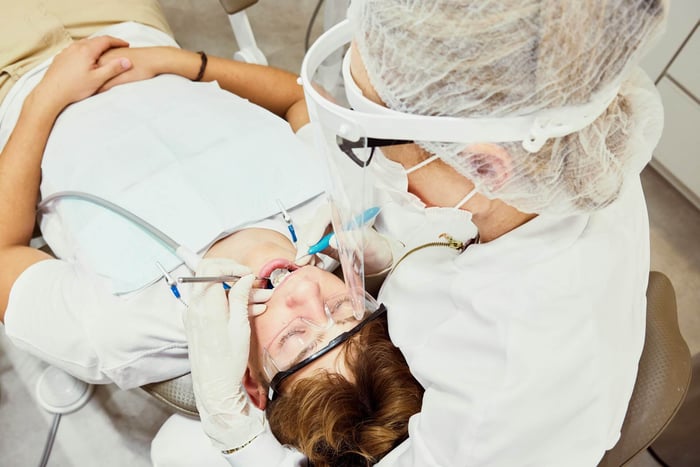 A dentist working on a patient