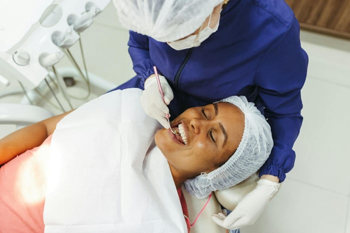 A patient lying on a dental chair