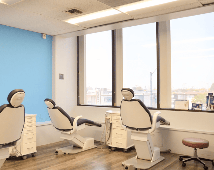 A dental room with three dental chairs