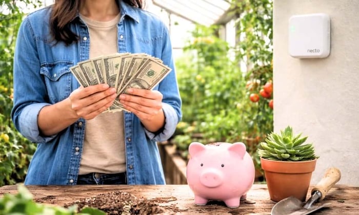 Person holding money inside a greenhouse with plants and a piggy bank, illustrating greenhouse gardening benefits and cost savings with a Necto monitor on the wall