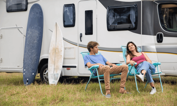 RV temperature monitoring keeps a couple relaxed outside their RV, knowing a cellular monitoring system is protecting their mobile home’s interior.