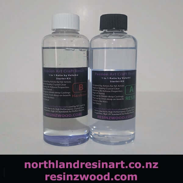 image of two bottles of PassionArt Resin with clear white background. one has a white lid and other one with a black lid.