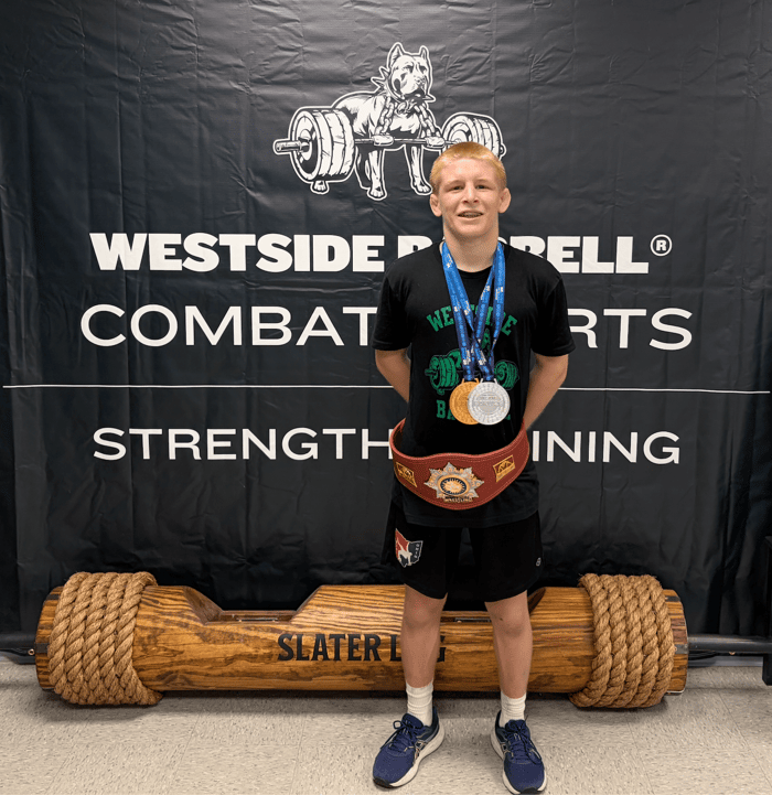 Rylen Wax wearing a championship belt and gold and silver medals after competing at the U17 World Championships.