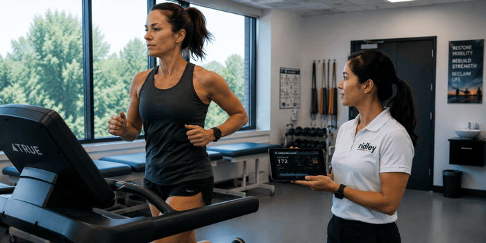 Female runner being coached on cadence and hip control during patellofemoral pain syndrome treatment in an outpatient physical therapy clinic