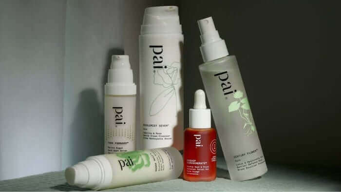 Collection of Pai Skincare products including cleanser, serum, and moisturizer arranged on white surface for nighttime skincare routine