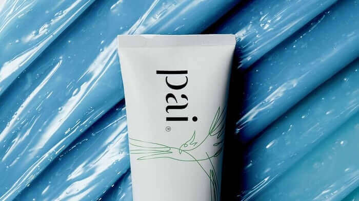 Pai Skincare Resurrection Girl face mask tube on blue brushstroke background for dry skin hydration