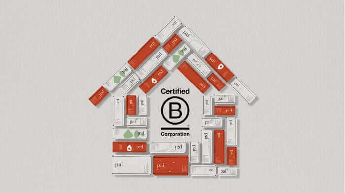 Pai Skincare product boxes arranged in house shape with Certified B Corporation logo in center, showcasing natural skincare brand's ethical commitment