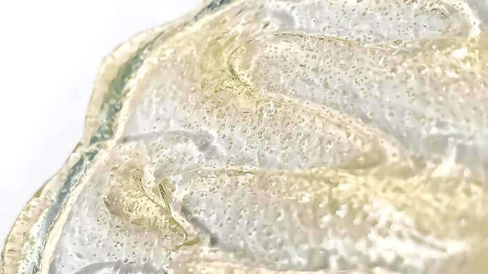 Close-up of gentle gel exfoliant texture with bubbles showing smooth, clear formula suitable for sensitive skin