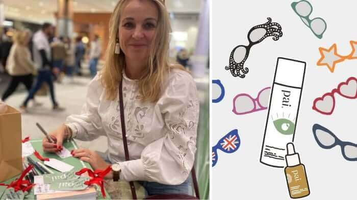 Blonde woman in white lace top wrapping Pai Skincare holiday gift sets with red ribbon at retail event, alongside illustrated gift wrap design featuring skincare products