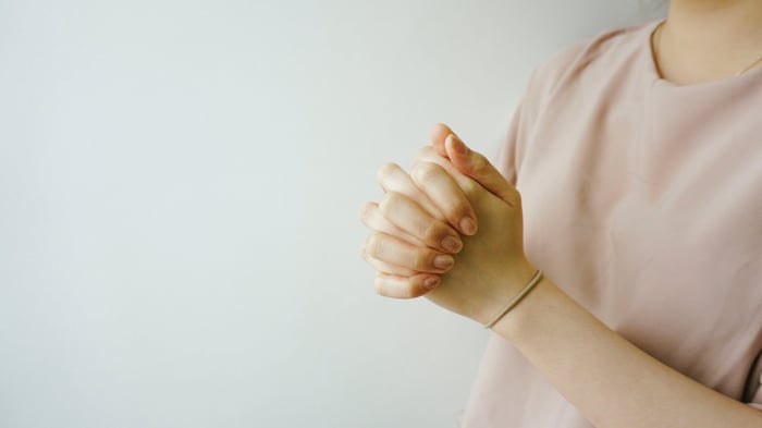 Hands clasped together showing gentle skincare routine for eczema-prone sensitive skin