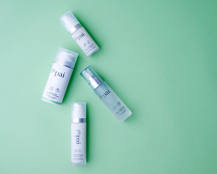 Four Pai Skincare products for sensitive skin arranged on mint green background including cleansers and serums