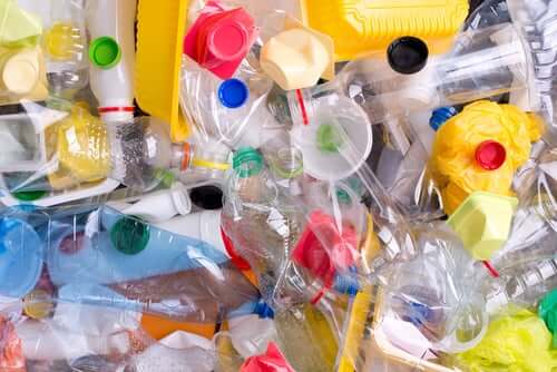 Pile of colorful plastic bottles and containers showing various packaging materials that may contain phthalates