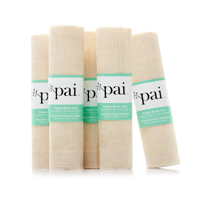 Four Pai Organic Muslin Cloths in natural beige fabric with green branded labels for gentle cleansing