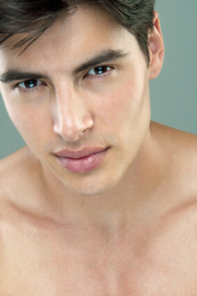 Portrait of young man with clear healthy skin after using natural skincare