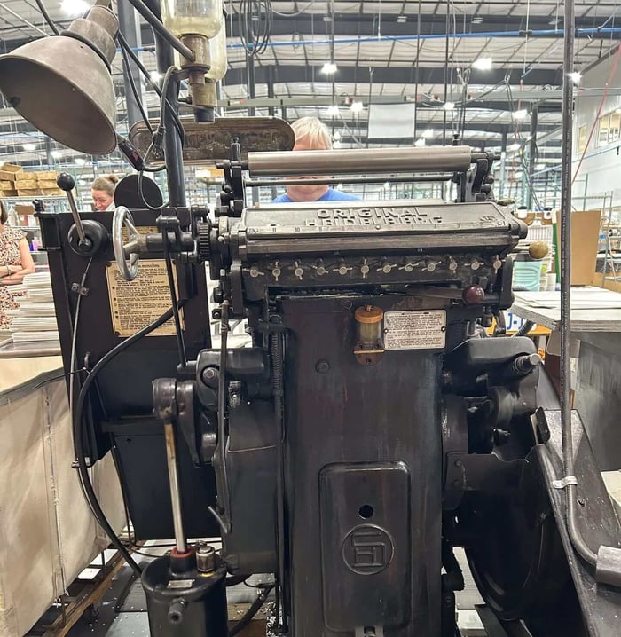 An original Heidelberg press still in operation at Hodges Badge Company.