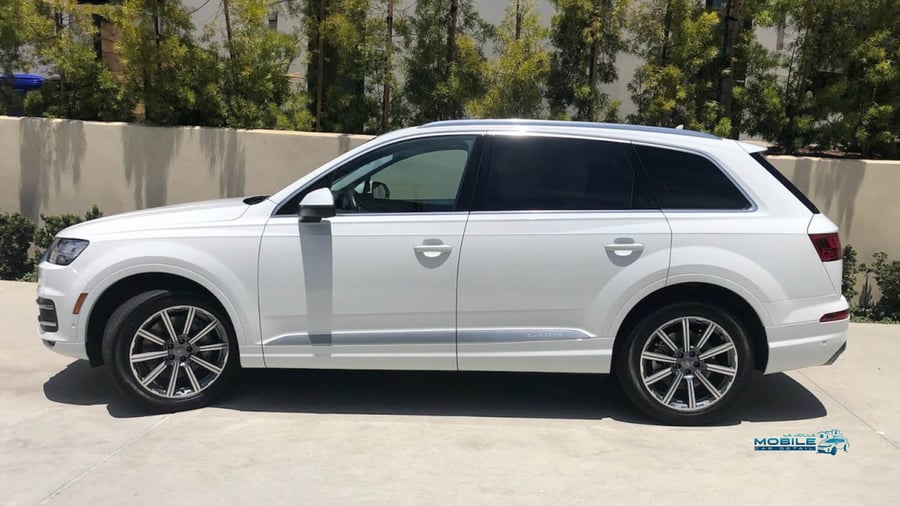 Car cleaning perfomed by a professional San Diego moble car detailer in a sunny La Jolla driveway