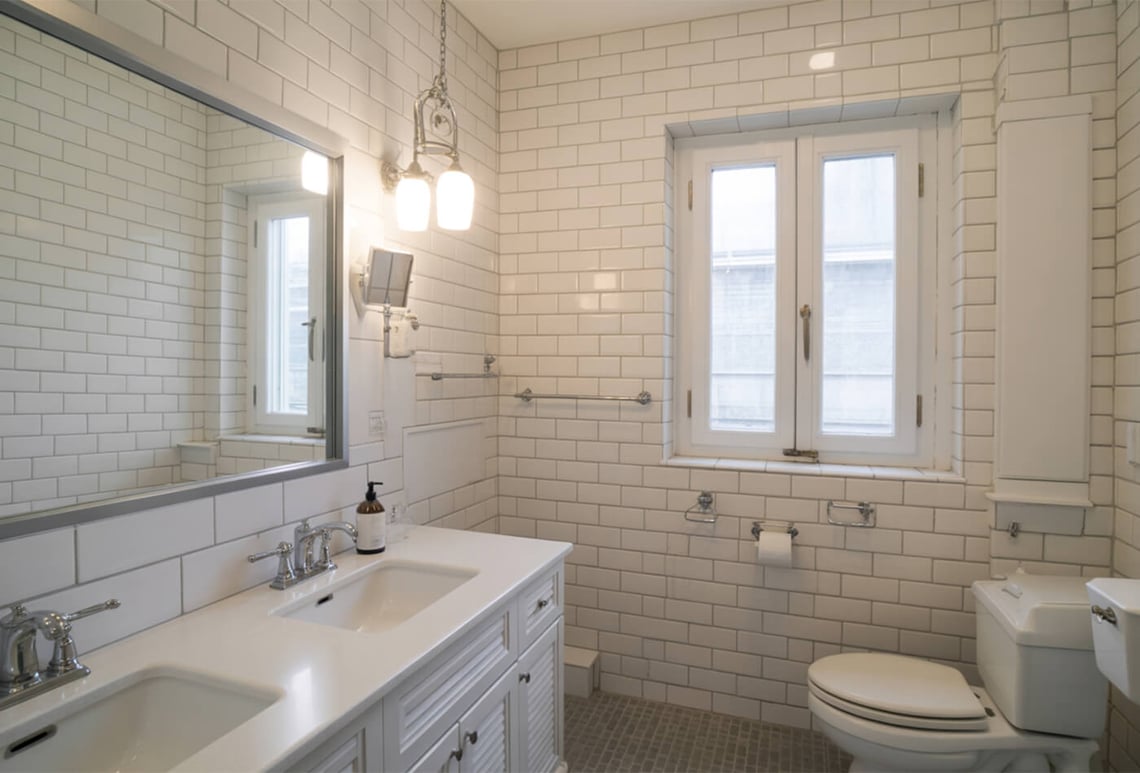 Why Stone Vanity Tops Matter In White Tile Bathrooms
