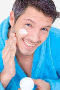 Man applying resveratrol cream for acne treatment showing clear skin results