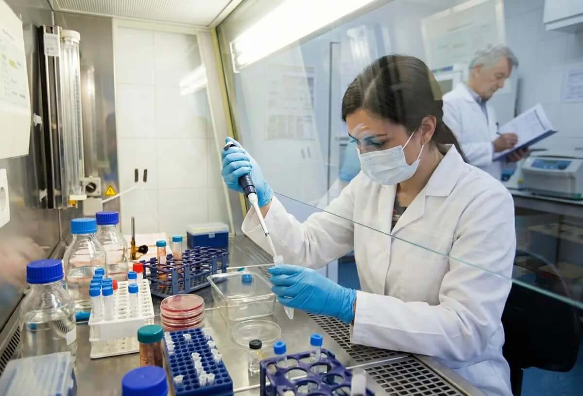 Scientists conducting cancer research with resveratrol in modern laboratory setting