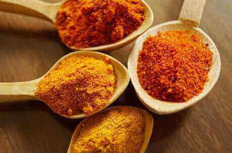 Fresh turmeric root displaying the natural golden color from curcumin compounds with anti-inflammatory and antioxidant properties