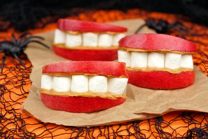 Healthy Halloween snack with apples, marshmallows, and peanut butter. 