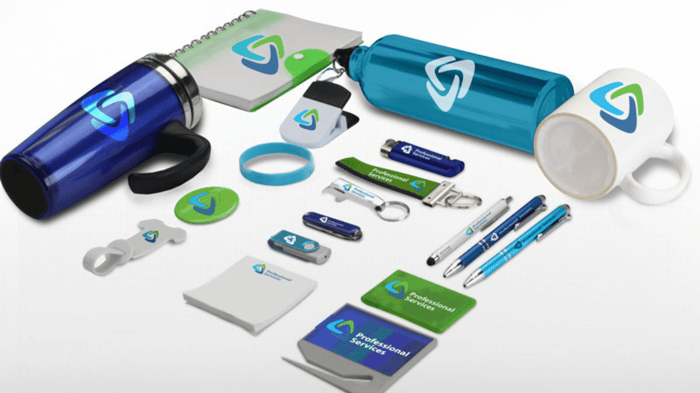 a lineup of custom swag with a logo on a white background including drinkware, pens, notebooks, and more