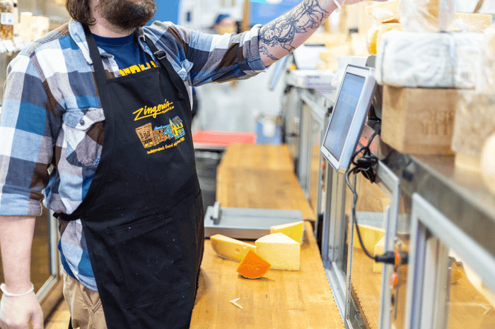 deli cheese worker wearing a custom apron