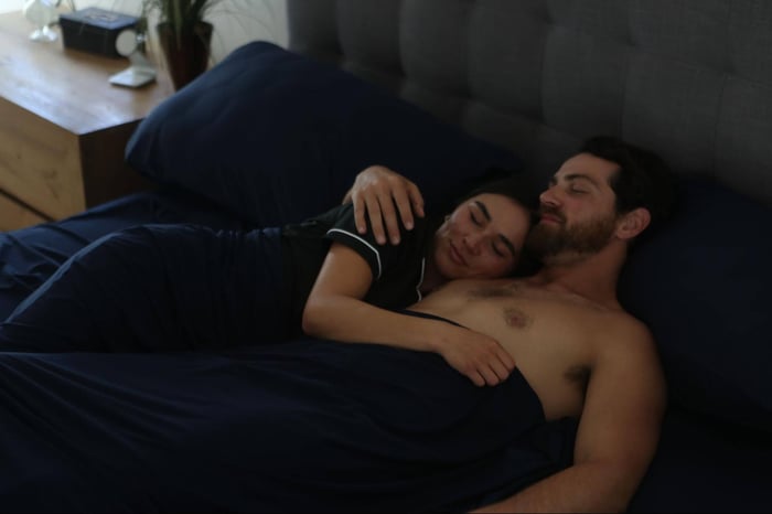Couple Cuddled Up in SHEEX Sheets for Valentine's Day