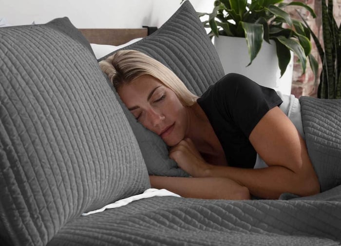 Woman Sleeping in Her SHEEX Blankets During the Winter