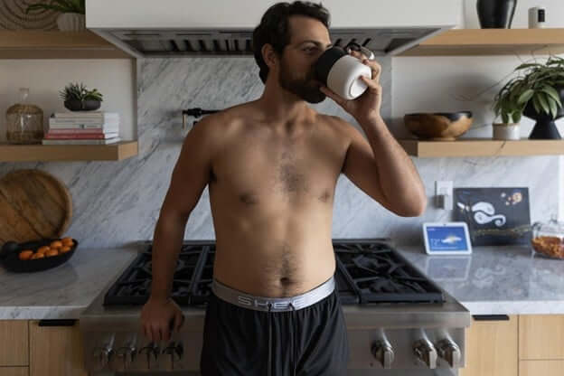 Man Drinking Coffee After Waking Up Refreshed