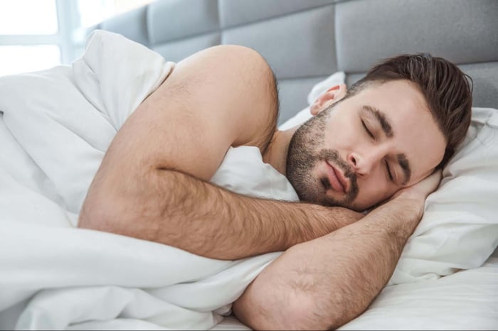 Man Sleeping Comfortable on His Side with a Side SHEEX Performance Pillow