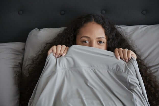 Woman Enjoying Her SHEEX Cooling King Size Sheets