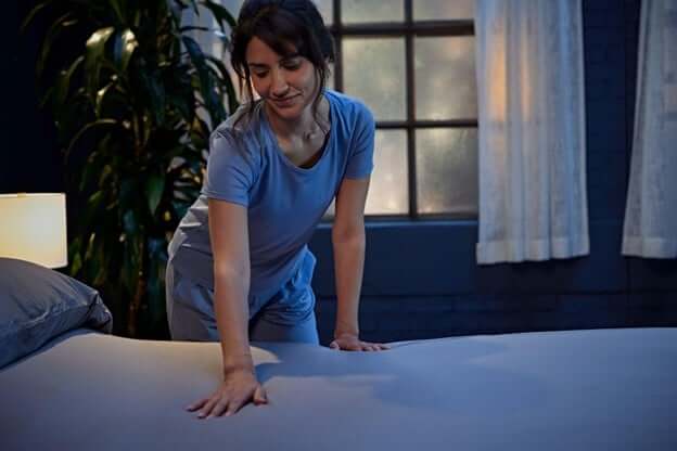 Woman Making Her Bed