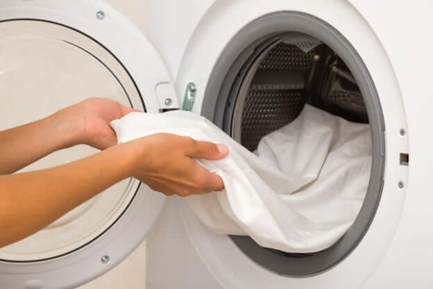 Woman Washing Her SHEEX Blanket