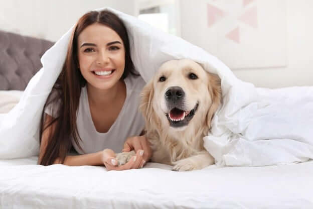 Woman with Her Dog Under SHEEX Covers